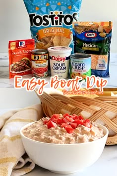 a bowl of oatmeal next to some chips and other snacks on a table