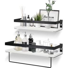 two white shelves with black metal brackets holding bottles and soaps