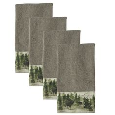 three bathroom rugs with trees and animals in the woods on them, set of four