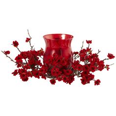 a red vase filled with flowers on top of a table