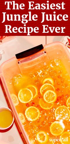 an orange juice recipe in a plastic container with lemons on the side and text overlay that reads, the fastest jungle juice recipe ever