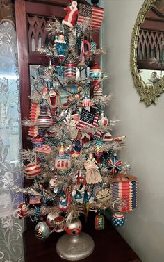 a christmas tree decorated with patriotic ornaments