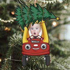 a christmas ornament with a baby in a car