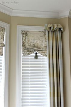 two windows with curtains and valances on them