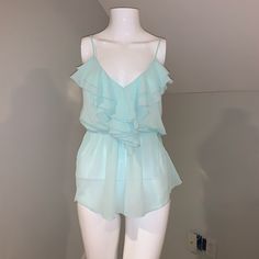 A Beautiful Baby Blue She Organza Material With The Ruffle Front And Adjustable Spaghetti Straps New With Tags Never Worn Blue Ruffled Top With Spaghetti Straps, Blue Spaghetti Strap Top With Ruffles, Blue Ruffled Spaghetti Strap Top, Organza Ruffle Top, Light Blue Feminine Ruffle Tops, Blue Fitted Ruffle Crop Top, Fitted Blue Ruffle Crop Top, Blue Ruffled Straps Tank Top, Neon Yellow Tops