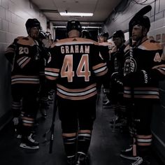 the hockey players are lined up in their locker room