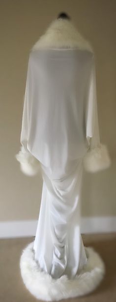 Gorgeous handmade,winter white velvet cocoon evening coat/robe with faux fur trim on collar cuffs and hem. Old Hollywood glamour for the modern diva, this beautiful gracefully elegant robe will envelope you in soft velvet and make you the starlet in your own classic movie! Based on an original Art Deco period pattern, this handmade robe has dolman batwing sleeves and beautiful draping in the back for an elegant,glamorous,relaxed and comfortable fit. Made from a high quality 350gsm stretch velvet White Long Sleeve Party Robe, White Long Sleeve Evening Robe, White Long Sleeve Winter Robe, Winter Robes, Evening Coat, White Velvet, Old Hollywood Glamour, Art Deco Period, Womens Robes