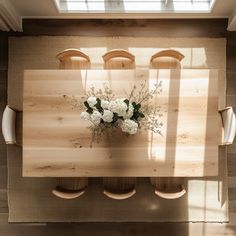 an overhead view of a dining room table with flowers on it