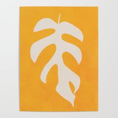 an orange and white painting with a leaf on it