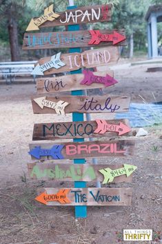 a wooden sign with many different languages on it