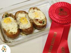 an award ribbon and some food in a container