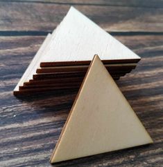 wooden triangle coasters stacked on top of each other