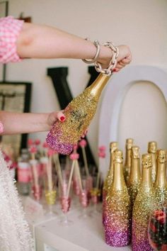 there are several shots of champagne being poured into wine bottles with pink and gold glitter on them