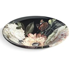 a black and white bowl with flowers on it