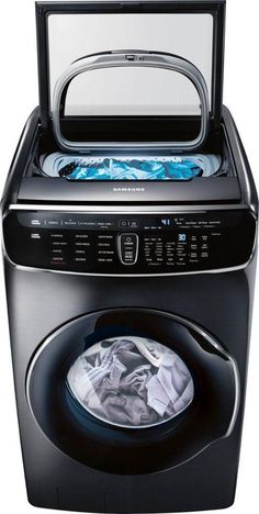 a washing machine with the door open and clothes in it's washer compartment