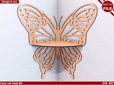 a wooden cutout of a butterfly on a wall with the text digital files below it