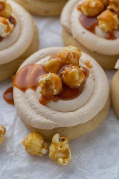 several cookies with caramel toppings on top of them and some popcorn in the middle