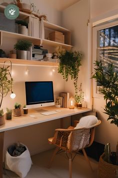 a desk with a computer and plants on it