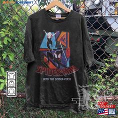 spiderman into the spider verse shirt hanging on a fence