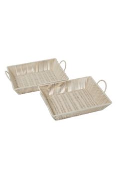 two white wicker trays with handles