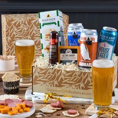 an assortment of beer and snacks on a table