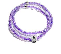 This set of two light purple seed bead bracelets is personalized with an initial of your choice. The beads are on a stretch cord and fits most sizes. The purple color of the beads is so pretty. Personalized gifts are special gifts to give to special people.  This is a stackable bracelet set.  Seed beaded bracelets make great christmas gifts, gift for her, or treat yourself.  You receive it in a gift box and it is ready to give.  Made on the top of the mountain with fresh air and beautiful views. Lavender Bracelets With Tiny Beads For Gift, Lavender Beaded Bracelet With Tiny Beads For Gifts, Adjustable Lavender Beaded Bracelets With Letter Beads, Purple Stretch Bracelet With Tiny Beads As Gift, Handmade Purple Name Bracelet With Round Beads, Adjustable Purple Beaded Name Bracelet, Personalized Purple Stretch Bracelet With Round Beads, Personalized Purple Round Beads Stretch Bracelet, Purple Stretch Bracelet With Letter Beads For Gift