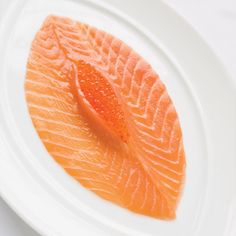 a piece of salmon on a white plate