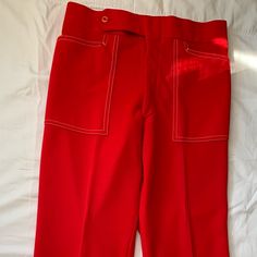 These Are Amazing Vintage Pants From The 60s And 70s. Unique White Stitching. Excellent Vintage Condition, Looks Like They Were Never Worn. Bought At A Vintage Shop And Sadly They Don’t Fit Me. Waist 15 Inches, Rise 12 Inches Retro Red Bottoms For Spring, Retro Red High-waisted Pants, Retro Fitted Red Pants, Vintage Red Wide Leg Pants, Vintage Red Fitted Bottoms, Retro Red Trousers, Red Fitted Vintage Bottoms, Vintage Red Pants With Pockets, Retro Red Workwear Bottoms