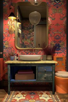 a bathroom with a sink, mirror and rug on the floor in front of it