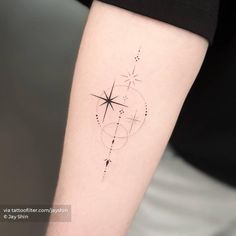 a woman's arm with a star tattoo on the left side of her body