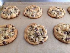 chocolate chip cookies on a baking sheet ready to be baked in the oven for consumption