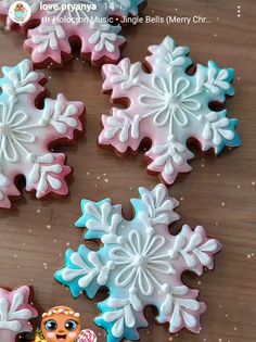 decorated sugar cookies with frosting on a wooden table