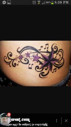 a woman's stomach with a star tattoo on it