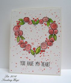 a heart shaped card with roses and leaves