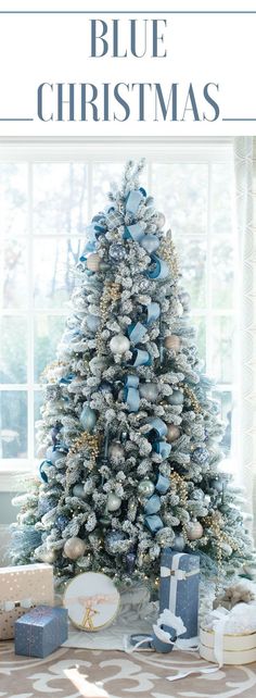 a blue christmas tree with presents under it