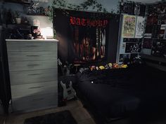 a bed room with a large poster on the wall