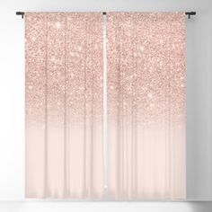 a pink ombreed curtain with glitter on it