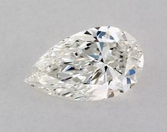 a pear shaped diamond on a white surface