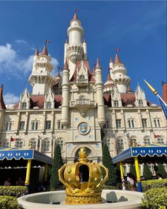 a castle with a fountain in front of it