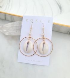 🌺ONE Pair of beautiful 14k Gold-Filled hoops with Moonstone gemstones and Cowrie shells. M A T E R I A L ♥14 Karat Gold Filled (GF) Wire & Earwire ♥White Cowrie Shells ♥Moonstone Gemstones S I Z E  ♥ about 1.75 inch long x 1.25 wide M E T A L ∙ D E S C R I P T I O N S ♥ GOLD-FILL: 14k Gold-fill jewelry is made with layers of genuine 14k gold bonded with heat to a base metal core. 14k Gold-fill jewelry has the same appearance as pure gold. Gold Filled may look dull if not used, but WILL NOT tarn White 14k Gold Filled Hoop Jewelry, White Small Hoop Jewelry For The Beach, White Hoop Jewelry For Summer, Elegant Small Hoop Jewelry For Beach, Elegant Small Hoop Jewelry For The Beach, Moonstone Gemstones, Metal Core, Earrings Beach, Beach Earrings