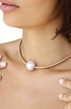 An imitation-pearl station contrasts with warm 18-karat-gold plating in this stackable necklace. 13 1/2" length; 5" extender Pearl size: 20mm Lobster clasp closure 18k-gold plate/acrylic imitation pearl Imported Chic Gold Pearl Choker, Stackable Necklaces, Station Necklace, Pearl Size, 18k Gold, Gold Plate, Nordstrom, Plating, Gold