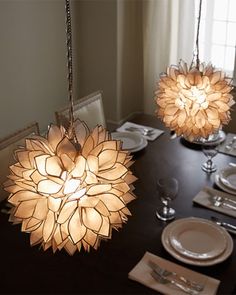 a dining room table is set with plates and place settings for two people to eat