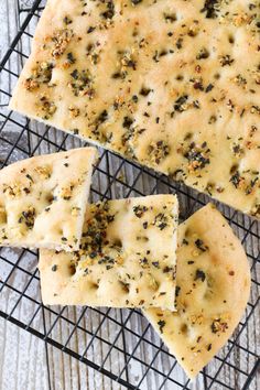 cheese crackers cooling on a wire rack with some seasoning sprinkles