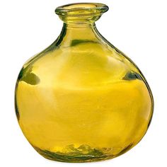 a yellow glass vase sitting on top of a table