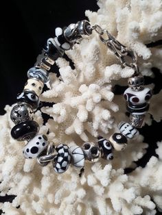 Amazing complete black and white 21 bead bracelet with 11 Trollbeads/ 6 Chamilla/ 1 ALE bracelet/ 3 unmarked. Bracelet is 8" inches with lock, fits 6.5 - 7.5 wrist! Excellent pre-loved condition.  Please review photos as they are part of the item description. The bead markings are in one picture. Spend $35 in my shop and shipping is free. Your item will come in a small, cotton filled, jewelry gift box. I specialize in Sterling Silver jewelry, my items are all estate jewelry. Most items are antiques from Victorian to the 1980's. Occasionally items are more recent and those are noted as prior to 2005. Most Antique & Vintage Items will show wear & imperfections consistent with their age and use. Please look at the pictures provided. I don't polish vintage jewelry, but I do clean each piece fo Trollbeads Bracelet, Black And White Theme, Bracelet Black, Jewelry Gift Box, Bead Bracelet, Estate Jewelry, One Pic, Art Glass, Antique Vintage