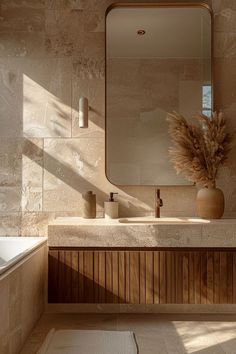 a bathroom with a sink, mirror and bathtub