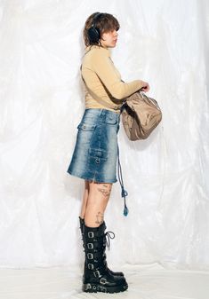 "This Y2K vintage cargo skirt is the ultimate throwback to your raver days. Channel your inner party animal with this mini in stonewashed blue shades. Features: - seven pockets - zip closure Every item we manage is cleaned and, when necessary, repaired, ensuring it arrives to you in top condition. Our model, Szedi is 170 cm / 66.3\" tall and she's a size L. Size: L / US 8 / UK 12 / IT 44 Measurements:  waist (seam to seam): 40 cm / 15.6\" length: 44 cm / 17.2\"" Y2k Denim Skirt For Streetwear, Y2k Style Mini Denim Skirt For Streetwear, Y2k Denim Mini Skirt For Streetwear, Y2k Style Fitted Cargo Skirt For Streetwear, Y2k Fitted Cargo Skirt For Streetwear, Fitted Y2k Cargo Skirt For Streetwear, Punk Denim Skirt With Pockets For Streetwear, Y2k Style Mini Cargo Skirt For Streetwear, Y2k Mini Cargo Skirt For Streetwear