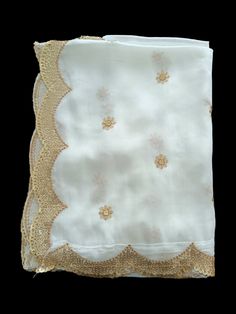 Designer White Chinon Embellished Scarf| White Dupatta| White Scarf| White Chunri | White Stole| White dupatta With Golden Work Fabric: Chinon Color: white Work:  Golden Sequins booty Zari and Golden Embroidery  Length: 2.4  metre Breadth: 92 cm Border:  Cutwork Border with Golden Motifs White Chinon dupatta is smooth, silky, and shiny. With a Booty of golden embroidery all over the dupatta. This embroidery with zari and golden motifs. Golden Zari and Motif border all  sides of the dupatta. This dupatta can be dyed in any color you want. You can use this dupatta in multiple ways. This Light Weight Dupatta is Embellished With Delicate Motifs & golden Work and a golden Zari Border. Team Up this Dupatta With Both Ethnic And Western Outfits for Signature Styles. TheArticraftIndia Read the desc White Stole, Embellished Scarf, White Dupatta, Golden Embroidery, White Scarf, White Scarves, Sequins Embroidery, Cut Work, Western Outfits