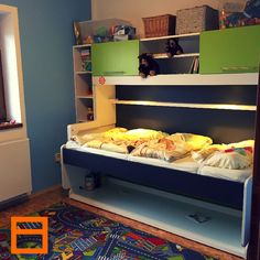 there is a bunk bed in the children's room with toys on the floor