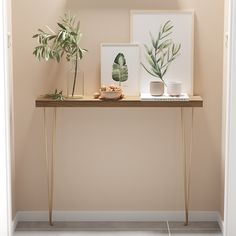 a table with plants and pictures on it